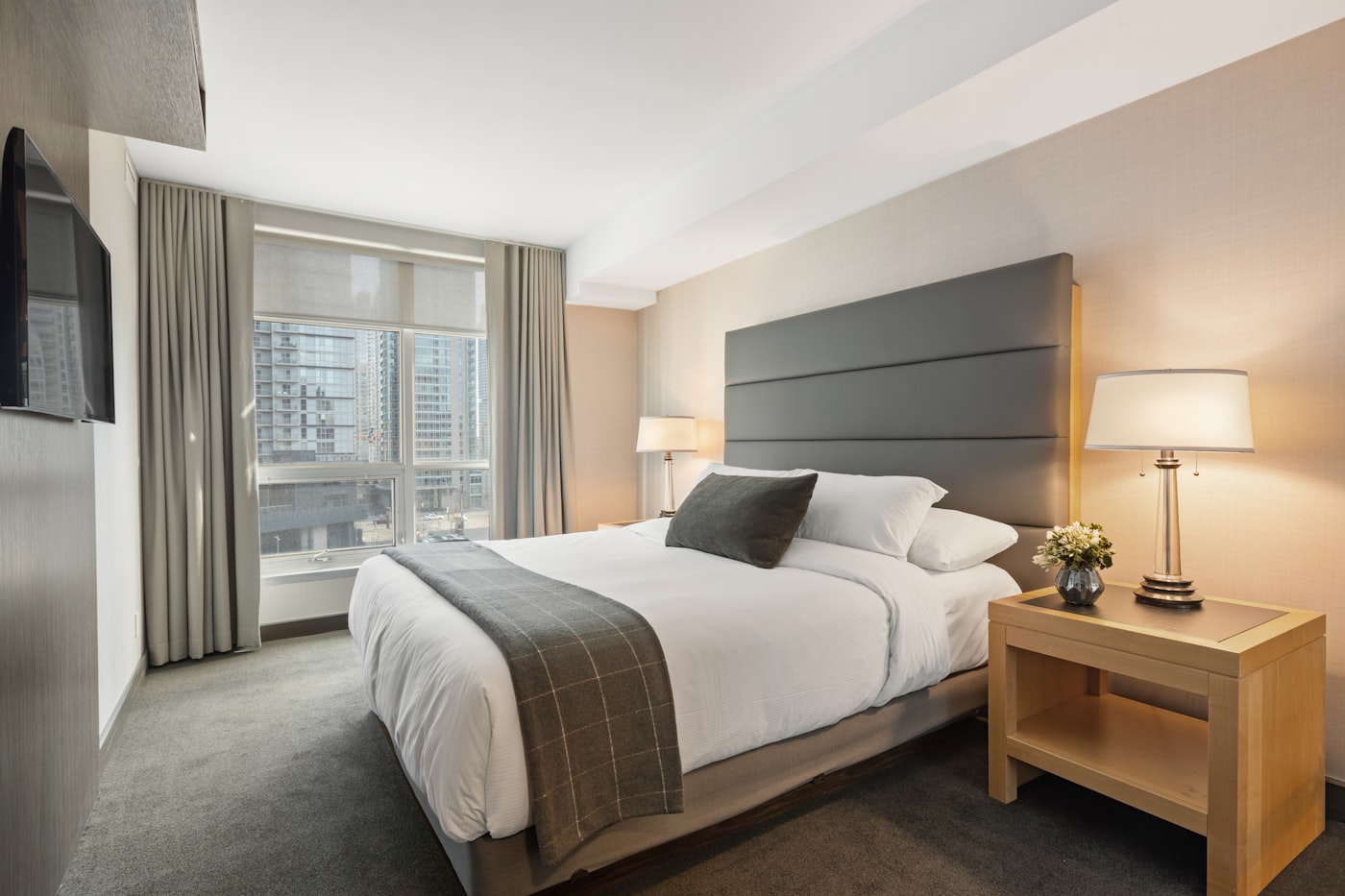 Stylish hotel bedroom with crisp bedding
